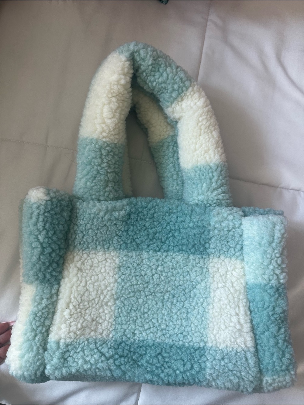 Blue and white shearling tote bag